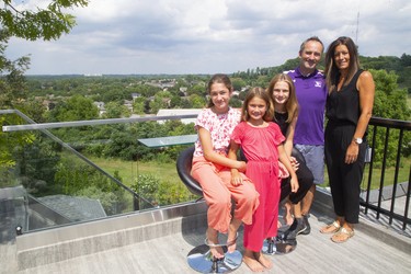 A roof top patio area on a clear day shows views all the way to Masonville from Byron at the home of Tienna, 12, Sofia, 8, Bella, 10, and Glen and Denise Martins at their Byron home that features an artificial turf soccer pitch in London, Ont.  Mike Hensen/The London Free Press/Postmedia Network