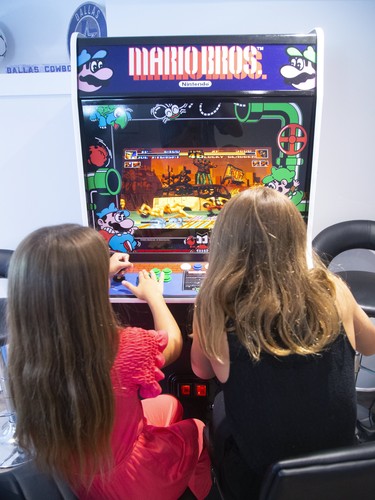 Sofia and Bella Martins enjoy Mario Bros. in the family's games room. (Mike Hensen/The London Free Press)