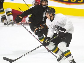 Luke Evangelista evades Jamie Mazomenos during an intrasquad game on the first day of the Knights training camp in London, Ont.   Mike Hensen/The London Free Press