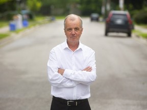 Phil Squire, the Ward 6 councillor for London stands at the epicentre of the illegal unofficial Western homecoming parties on Broughdale Avenue at Audrey Avenue in London, Ont.  (Mike Hensen/The London Free Press)