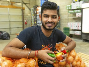 Divyansh Ojha, founder and chief executive of FoodFund in London,  provides growers with a market for imperfect produce so there is less food waste in the farm field. Ojha delivers imperfect produce weekly to his base of subscribers.  (Mike Hensen/The London Free Press)