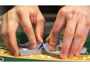 Dealers are busy getting ready to work Thursday as eight new table games are open at the Western Fair slots in London. The tables are a precursor to the new casino opening up on Wonderland Road South.  (Mike Hensen/The London Free Press)