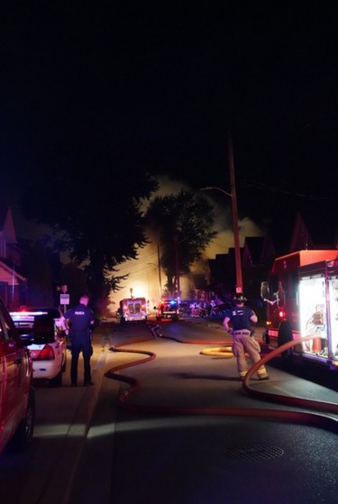 London firefighters battle a major fire on Woodman Aveune and Queens Avenue in Old East Village after a car slammed into a house. (MAX MARTIN, The London Free Press)