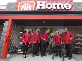 Tuckey Home Hardware owner Dave Tuckey is joined by his parents, Don and Eleanor Tuckey, and Home Hardware representatives Aida Kelly, left, Jim Grein, Dave Greenwood and Dale MacPherson, right, as he cuts a ribbon to celebrate the completion of a major addition to the Wortley Village hardware store in London. (File photo)