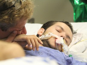 Abby Roby (left) has been by her son Tristan's hospital bed since June 21, just three days before his 18th birthday, when he was critically injured in a hit-and-run crash while cycling in east London. (Sebastian Bron, The London Free Press)