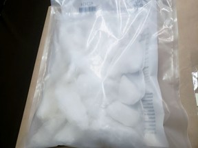 Police said more than $200,000 in drugs, as well as cash and offence-related property, was seized through search warrants at properties in North Perth and Minto township. (Handout)