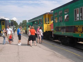 Tourists line up to board the Port Stanley Terminal Rail train