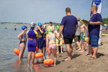 Josh Reid, co-director of South West Ontario Open Water Swim, teaches a group about open water swimming.