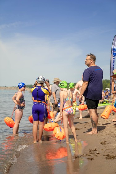 Josh Reid, co-director of South West Ontario Open Water Swim, teaches a group about open water swimming.