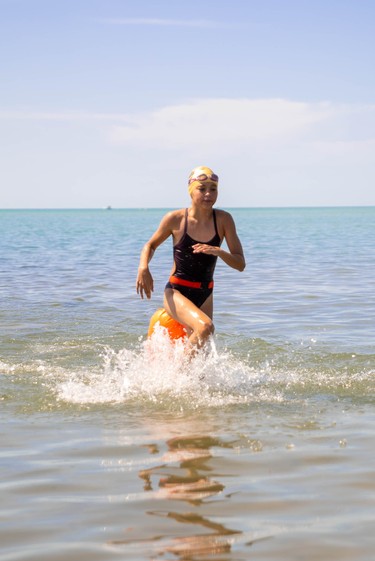 Julia Notebomer, 12, completes a five-kilometre swim at Port Stanley beach.