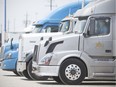 A trucker sits in his cab at the Husky truck stop, Friday, June 8, 2018.