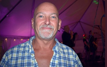 Ribfest organizer Doug Hillier enjoying Mudmen on Sunday. (BARBARA TAYLOR, The  London Free Press)