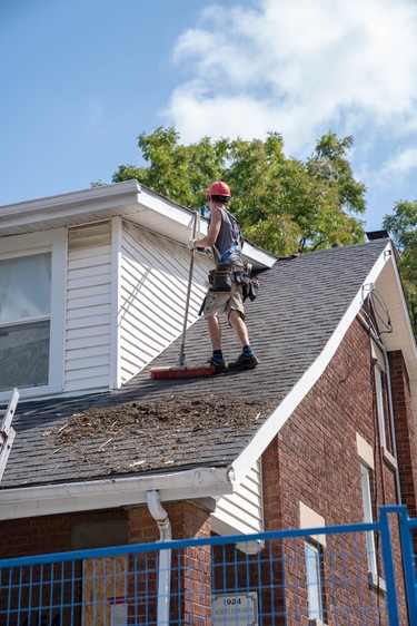 Crews continue to clean up the destruction on Woodman Avenue Saturday morning. Three homes on the street have been demolished.