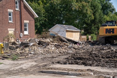 The house that once stood at 452 Woodman Avenue was demolished by crews Saturday morning.