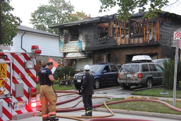 London firefighters responded to a reports of house fire on Millbank Drive early Tuesday. One man was taken to hospital with minor injuries following the blaze, which caused extensive damage to the home. JONATHAN JUHA/THE LONDON FREE PRESS