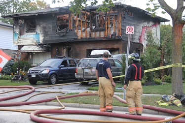 London firefighters responded to a reports of house fire on Millbank Drive early Tuesday. One man was taken to hospital with minor injuries following the blaze, which caused extensive damage to the home. JONATHAN JUHA/THE LONDON FREE PRESS