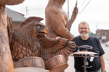 Dave Broostad, project coordinator for the Hamilton Road BIA, is sharing the stories behind the Hamilton Road tree trunk tour sculptures this weekend as part of Doors Open London. One of the newest sculptures was created for the Juno Awards and features an animal rock band. (MAX MARTIN, The London Free Press)
