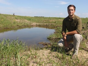 Peter Moddle, ALUS Middlesex project co-ordinator, is next to a wetland being created by the group at a Thames Centre farm, one of a dozens of projects the area chapter has developed in the county. (JONATHAN JUHA, The London Free Press)