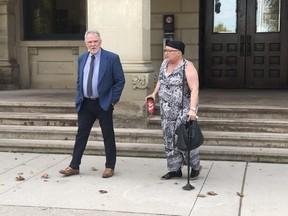 Kevin Egan, lawyer for the family of Mike Fall, and Lisa Ur, Fall's former partner, leave the Elgin County Courthouse in St. Thomas Wednesday, on the third day of testimony in the coroner's inquest into Fall's 2017 death at the Elgin-Middlesex Detention Centre. (Jennifer Bieman/The London Free Press)