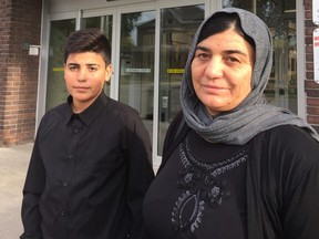 Yazidi refugees Naro and her son Dawod, who came to London in early 2018 to flee an ISIS driven genocide, stand outside the Cross Cultural Learner Centre, which has collaborated with the National Film Board of Canada to premiere a film, Angel Peacock, that explores their settling in London. ItÕs one of five short films being screened Sunday at Wolf Performance Hall.