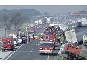 Hundreds of emergency vehicles line highway 401 following a multi-vehicle pileup along the westbound lanes of Highway 401 just east of Windsor on Sept. 3, 1999. The accident occurred in extreme foggy conditions. Eight people died and 45 were injured, involving a total of 87 vehicles.