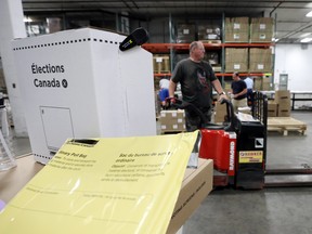 Workers prepare materials at the Elections Canada distribution centre in advance of the upcoming federal election, in Ottawa, Ontario, Canada. REUTERS/Chris Wattie
