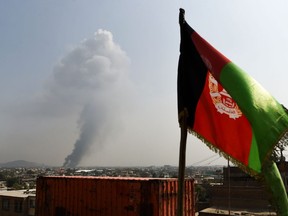 Smoke rises from the site of an attack after a massive explosion the night before near the Green Village in Kabul on September 3, 2019. - A massive blast in a residential area of Kabul killed at least 16 people, officials said on September 3, yet another Taliban attack that came as the insurgents and Washington try to finalise a peace deal. (Photo by Wakil KOHSAR / AFP)