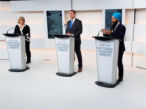 Green Party leader Elizabeth May, Conservative leader Andrew Scheer and New Democratic Party (NDP) leader Jagmeet Singh take part in the Maclean's/Citytv National Leaders Debate alongside an empty place due to the non appearance of Prime Minister Justin Trudeau, on the second day of the election campaign in Toronto, Ontario, Canada September 12, 2019. Picture taken September 12, 2019. (Frank Gunn/Pool via REUTERS)
