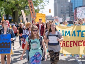 Karissa Vizniowski, 13, marches with hundreds of other students as part of the Global Climate Strike on September 20, 2019. The group marched down Dufferin Street, up Richmond Street, across Oxford Street before returning to city hall. (Max Martin, The London Free Press)
