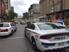 London police cruisers block off a portion of King Street in downtown London on Tuesday Sept. 3, 2019. Two shots were fired and a man with an 