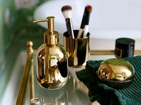 Brass inspired accessories by H&M in Poppy Delevingne's home.