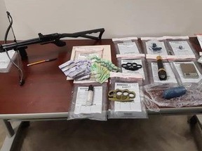 A cache of weapons and drugs Sarnia police say was seized during a drug bust Wednesday in Sarnia. (Submitted)