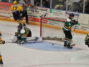 The puck rolls back out of the net after the Erie Otters scored on rookie London Knights goalie Matt Onuska in a neutral-site exhibition game at the Central Huron Community Complex in Clinton. Erie won, 7-2. Photo taken Saturday, Sept. 14, 2019. (Daniel Caudle/Postmedia)