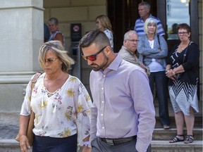 Joshua Houston leaves the Elgin County Courthouse with his mother Sheri Houston in St. Thomas, Ont. on Friday August 23, 2019. (Derek Ruttan/The London Free Press)