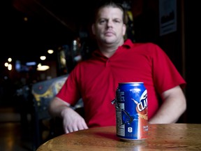 Mark Dencev, general manager of The Richmond Tavern saved a can of Clamato juice that was pierced by a police officer's bullet on Tuesday. Photo shot in London, Ont. on Wednesday September 4, 2019. Derek Ruttan/The London Free Press/Postmedia Network