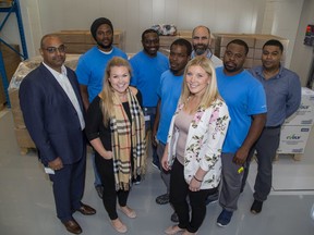 Employees at Starlim North America are sending essentials such as water, medicine, clothes and toiletries to the Bahamas to help relatives of employees who have been affected by Hurricane Dorian. Gathered here are Starlim chief executive Vijai Lakshmikanthan, left, Angelo Ferguson, Natalie Meek, Stephen Gardiner, Trumane Brown, Katie Ross, Gary McCorquodale, Gevon Hall and Ajay George. (Derek Ruttan/The London Free Press)