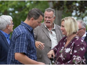 Craig Short, 59, laughs with supporters outside the Elgin County courthouse in St. Thomas, where a judge acquitted him Monday after his third trial for murder in the 2008 slaying of his wife, Barbara. (Derek Ruttan/The London Free Press)