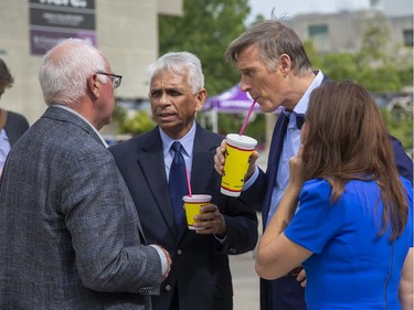 The People's Party of Canada leader Maxime Bernier (second from right) enjoys a refreshment with party members  including London North Centre candidate Salim Mansur (second from left) and London Fanshawe candidate Bela Kosoia (right) during a visit to the University Community Centre at Western University  in London, Ont. on Tuesday September 10, 2019. (Derek Ruttan/The London Free Press)