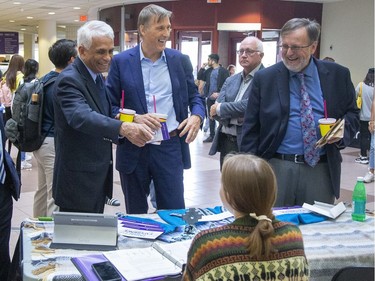 The People's Party of Canada leader Maxime Bernier (second from left) and London North Centre candidate Salim Mansur (left) speak with 2nd year medical sciences student Colette Benko during a visit to the University Community Centre at Western University  in London, Ont. on Tuesday September 10, 2019. (Derek Ruttan/The London Free Press)