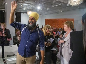 NDP leader Jagmeet Singh waves to supporters after entering a room full of party faithful during a rally at Goodwill Industries in London, Ont. on Tuesday Sept. 10, 2019. (Derek Ruttan/The London Free Press)
