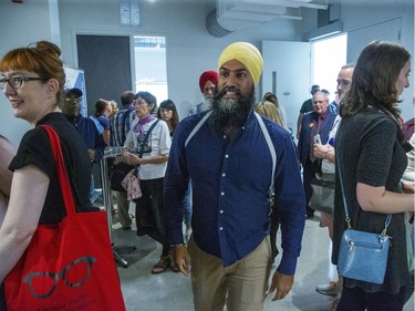 NDP leader Jagmeet Singh enters a room full of party faithful during a rally at Goodwill Industries in London, Ont. on Tuesday September 10, 2019. (Derek Ruttan/The London Free Press)