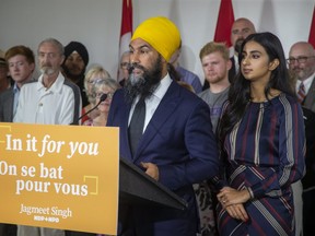 With his wife Gurkiran Kaur Sidhu by his side and dozens of party members behind him, Jagmeet Singh kicked off the NDP's election campaign at Goodwill Industries in London, Ont. on Wednesday. (Derek Ruttan/The London Free Press)