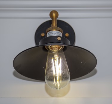 An Edison bulb accents the kitchen at 398 Regent St.. Derek Ruttan/The London Free Press/Postmedia Network