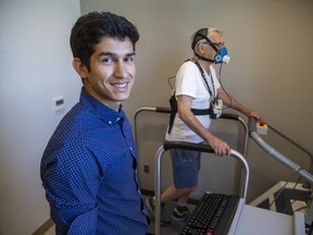 Phd. candidate Narlon Silva with study subject Bill Warren at the Western Centre for Public Health and Family Medicine in London. (Derek Ruttan/The London Free Press)