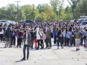 Saunders Secondary School was evacuated after a mysterious odour made some staff and students feel ill in London. Fire fighters discovered that a dust collection system being dismantled at the school was the cause. (Derek Ruttan/The London Free Press)
