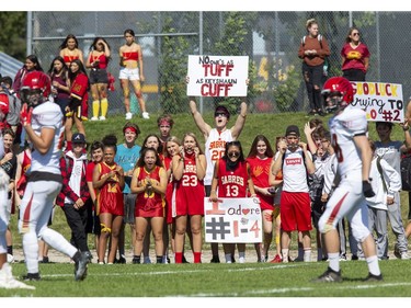 Saunders Sabres fans cheer on their football team as they host the Clarke Road Trojans during the United Way game in London on Thursday Sept. 19, 2019. Students were allowed to miss classes and attend the game by purchasing a ticket to the United Way fund raiser. (Derek Ruttan/The London Free Press)