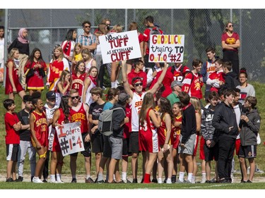 Saunders Sabres fans cheer on their football team as they host the Clarke Road Trojans during the United Way game in London on Thursday Sept. 19, 2019. Students were allowed to miss classes and attend the game by purchasing a ticket to the United Way fund raiser. (Derek Ruttan/The London Free Press)