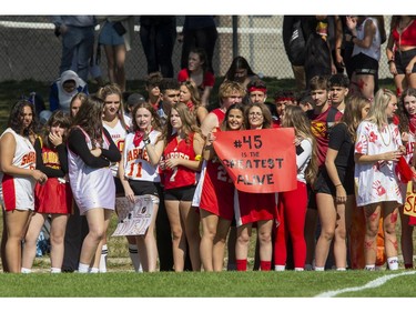 Saunders Sabres fans cheer on their football team as they host the Clarke Road Trojans during the United Way game in London on Thursday Sept. 19, 2019. Students were allowed to miss classes and attend the game by purchasing a ticket to the United Way fund raiser. (Derek Ruttan/The London Free Press)