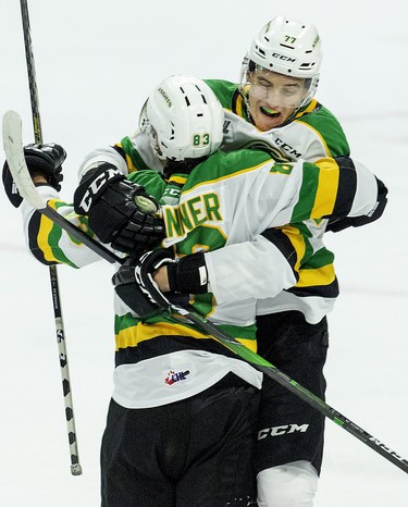 Matvey Gustov leaps into the arms of goal scorer Hunter Skinner after he put the London Knight ahead 1-0 against the Peterborough Petes   in London, Ont. on Saturday September 21, 2019. Derek Ruttan/The London Free Press/Postmedia Network