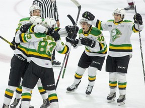 London Knights celebrate their first goal of the season by Hunter Skinner during the first period of their game at Bud Gardens in London, Ont. on Saturday September 21, 2019.  L To R Kirill Steklov, Matvey Gustov, Hunter Skinner, Antonio Stranges and Luke Evangelista.  (Derek Ruttan/The London Free Press)